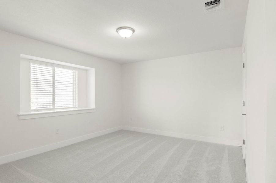 Unfurnished room with light colored carpet and baseboards Unfurnished room with light colored carpet and baseboards