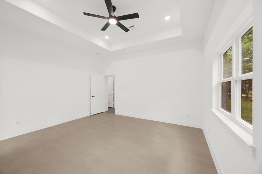 Alternate view showcasing the generous size and natural light of the primary bedroom