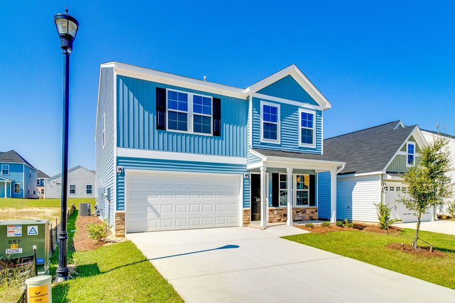 Front exterior of a new home in Winston Point, Gilbert, SC, highlighting curb appeal (Image 18).