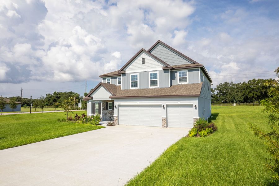 Representative exterior photo of a completed home built from the Columbus by Maronda Homes in Malabar Springs, Palm Bay, FL (Image 2). Representative exterior photo of a completed home built from the Columbus by Maronda Homes in Malabar Springs, Palm Bay, FL (Image 2).