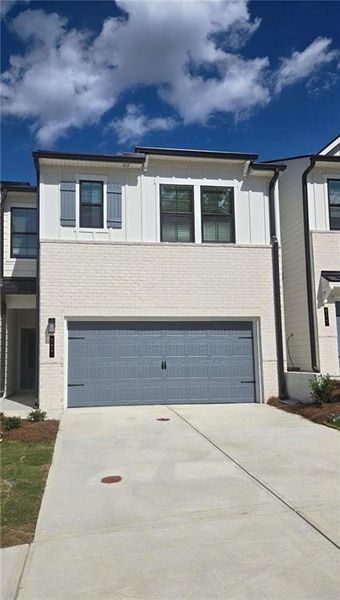 Front exterior of a new home in Azalea Square Townhomes, Lawrenceville, GA, highlighting curb appeal (Image 28).