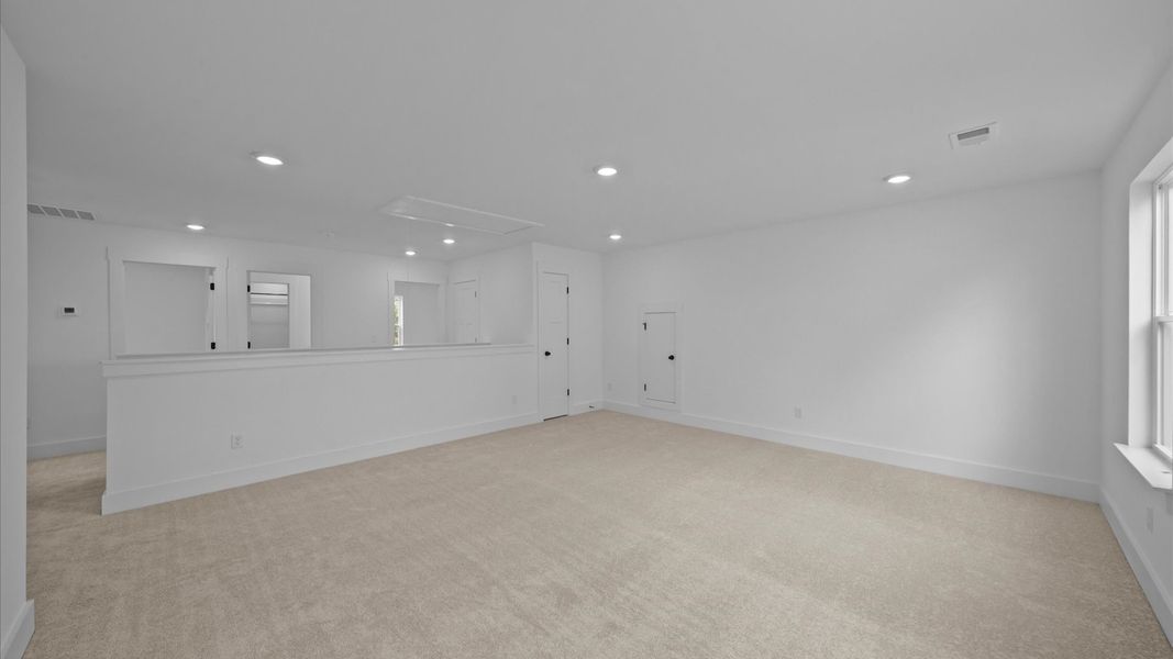 Elegant, carpeted loft that adds a superior layer of flexibility to the home’s design Elegant, carpeted loft that adds a superior layer of flexibility to the home’s design