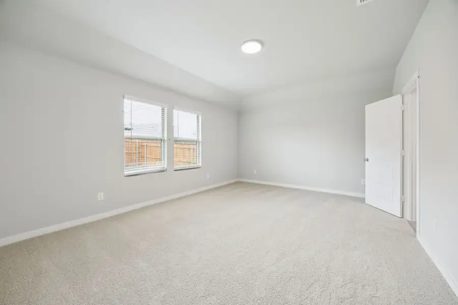 Primary Suite in the Hayden home plan by Trophy Signature Homes – REPRESENTATIVE PHOTO