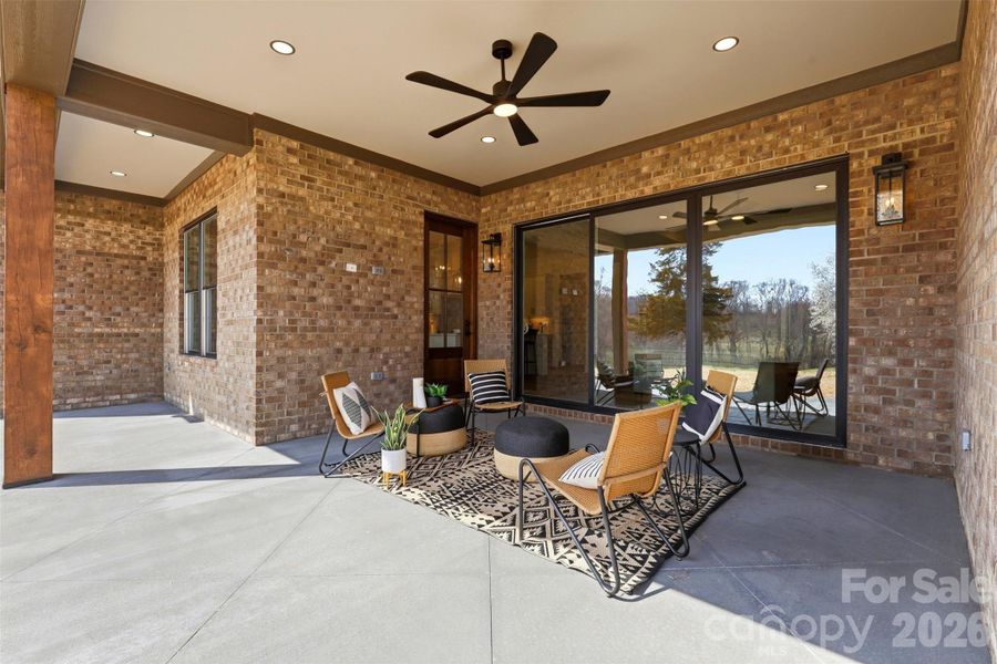 covered rear porch- great for outdoor entertaining or simply taking in the picturesque country views!