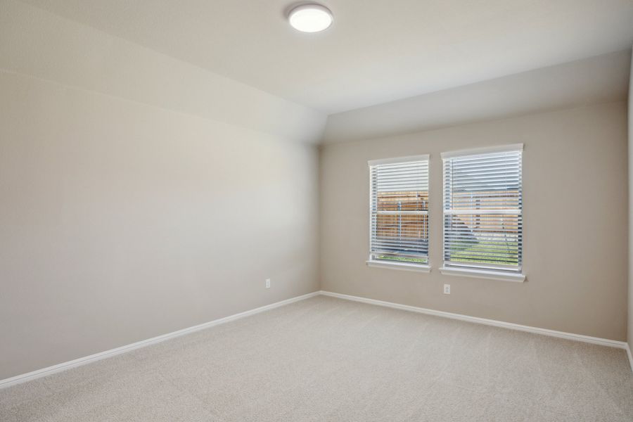 Bedroom in the Harper home plan by Trophy Signature Homes – REPRESENTATIVE PHOTO