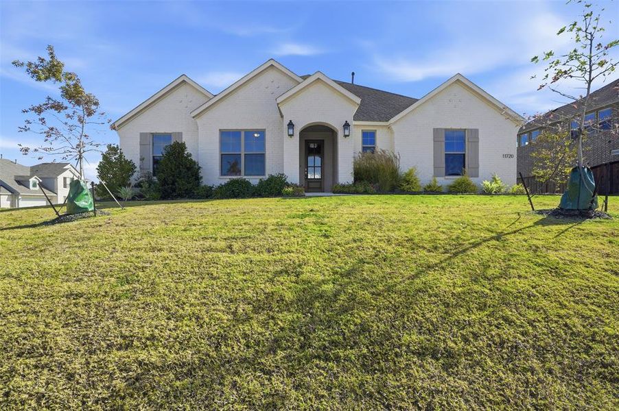 Front exterior of a new home in Wildcat Ridge, Godley, TX, highlighting curb appeal (Image 1). Front exterior of a new home in Wildcat Ridge, Godley, TX, highlighting curb appeal (Image 1).