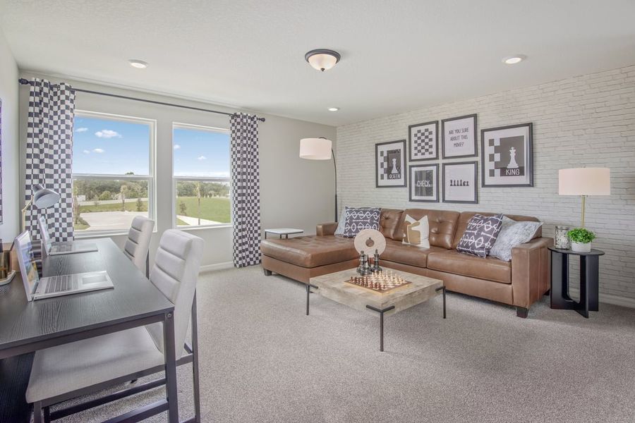 Representative furnished interior of a home built from the 2566 Modeled by KB Home in Sandal Key II, Weeki Wachee (Image 6).