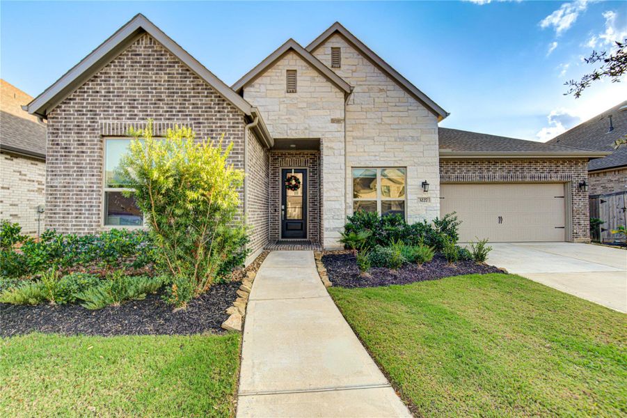Front exterior of a new home in Jordan Ranch: Vista Collection, Fulshear, TX, highlighting curb appeal (Image 23).