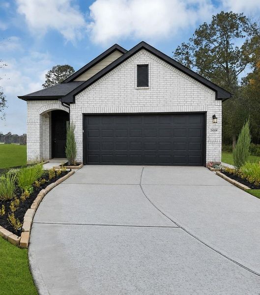 Front exterior of a new home in , Iowa Colony, TX, highlighting curb appeal (Image 1). Front exterior of a new home in , Iowa Colony, TX, highlighting curb appeal (Image 1).