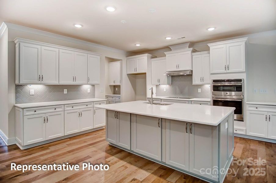 This home will have a gas cooktop with designer range hood & direct vent exhaust