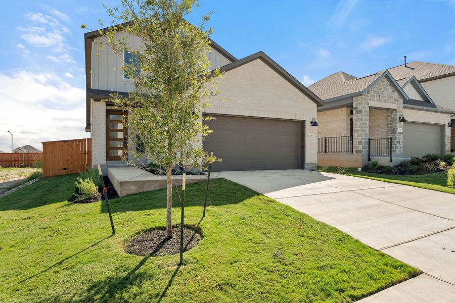 Front exterior of a new home in Lariat, Liberty Hill, TX, highlighting curb appeal (Image 25).