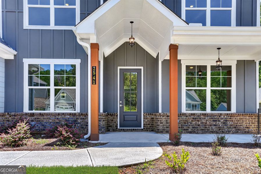 Exterior details and patio area of a home in The Manor at Gainesville Township, Gainesville (Image 3).