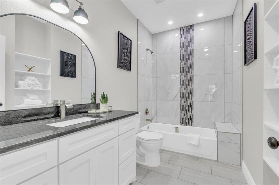 Bathroom with bathtub / shower combination and vanity