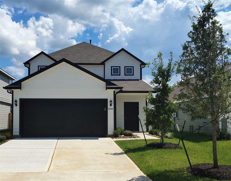 Front exterior of a new home in Cliffstone Hills, Conroe, TX, highlighting curb appeal (Image 2).