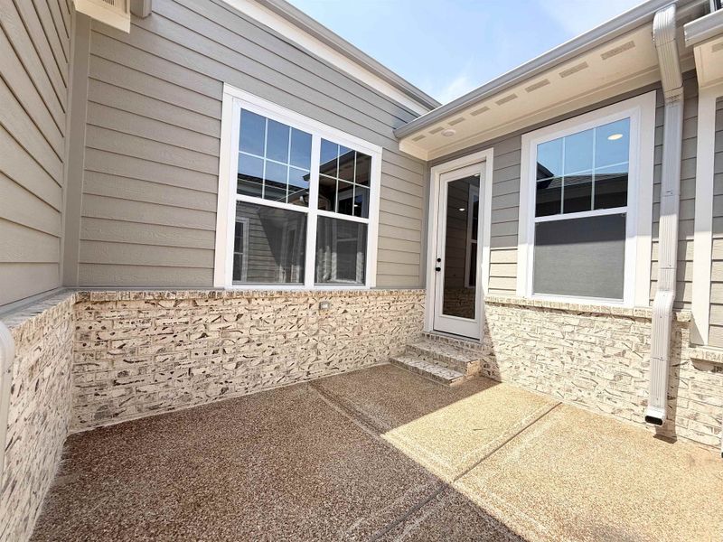 Doorway to property with a patio