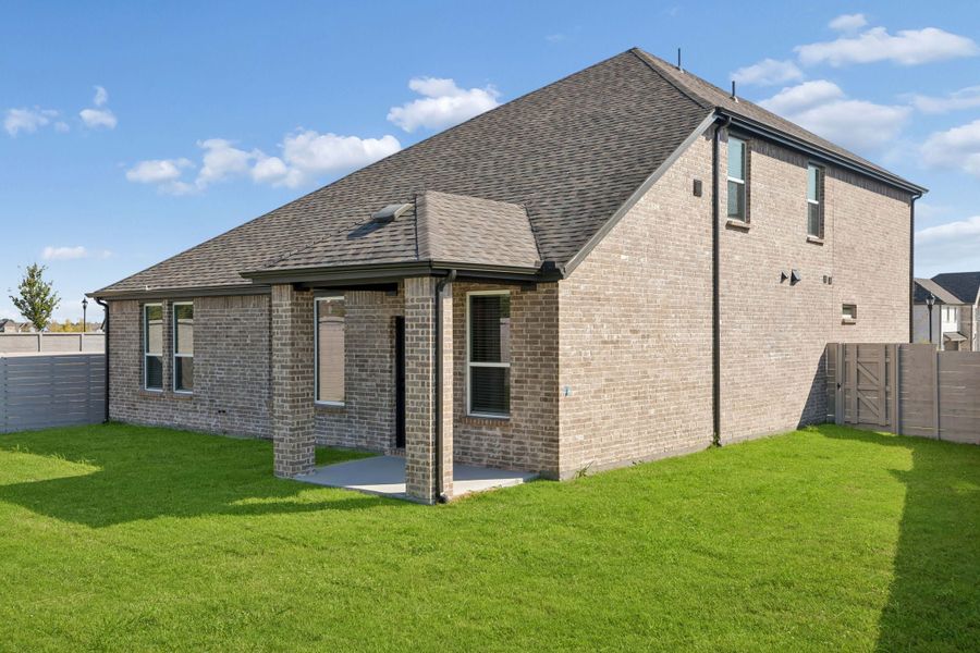 Exterior details and patio area of a home in Painted Tree Woodland West, McKinney (Image 3).