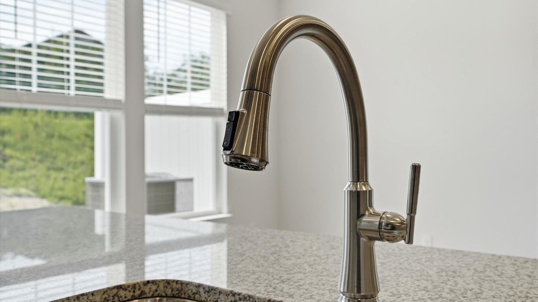 Accomplished layout with a first-class kitchen in this select villa community by DRB Homes