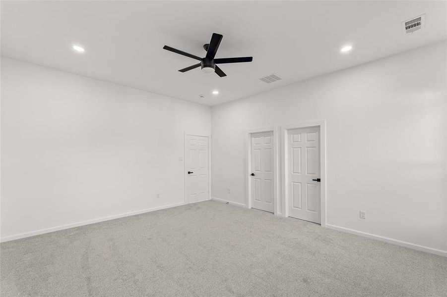 Carpeted spare room featuring recessed lighting and ceiling fan