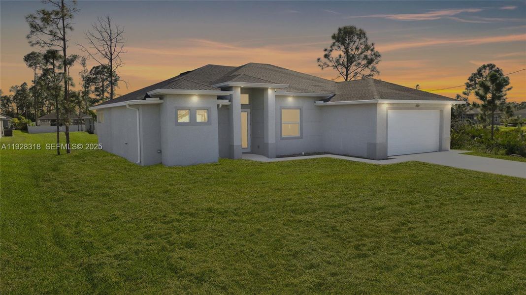 Front exterior of a new home in , Lehigh Acres, FL, highlighting curb appeal (Image 1). Front exterior of a new home in , Lehigh Acres, FL, highlighting curb appeal (Image 1).