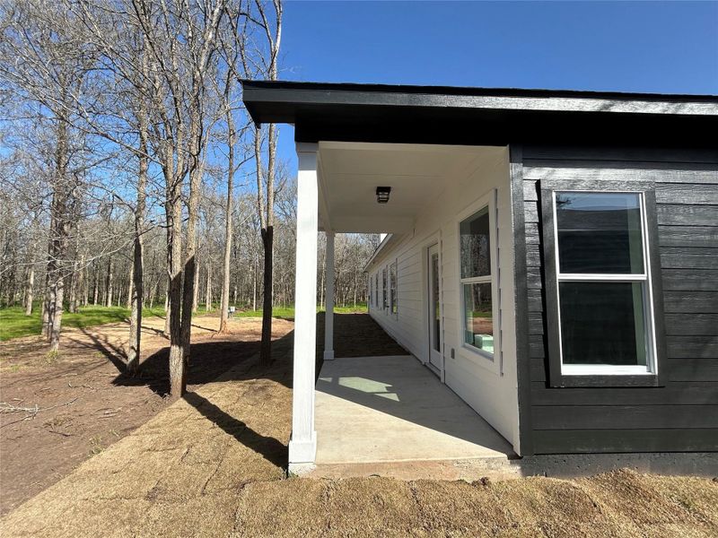 View of side of home with a patio area