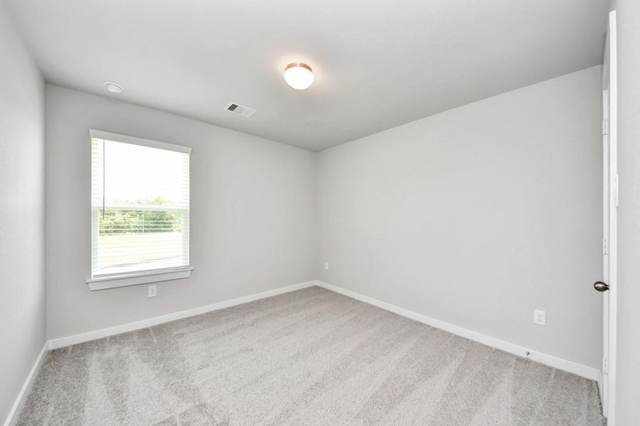 Secondary bedroom features plush carpeting, large windows that let in plenty of natural light, bright paint, and spacious closets. Secondary bedroom features plush carpeting, large windows that let in plenty of natural light, bright paint, and spacious closets.