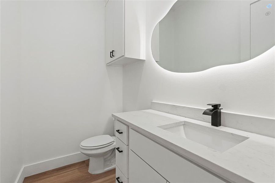 Bathroom with vanity and light wood-style floors