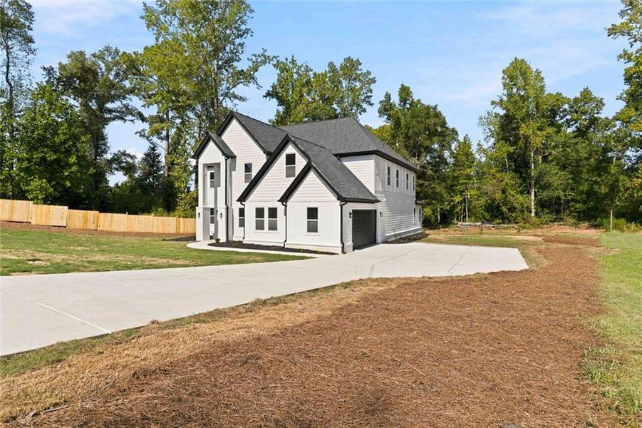 Front exterior of a new home in , Griffin, GA, highlighting curb appeal (Image 28).