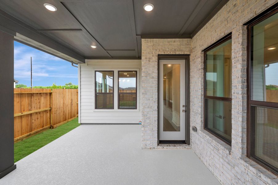 Exterior details and patio area of a home in Riceland - Enclave Row Collection, Mont Belvieu (Image 4).