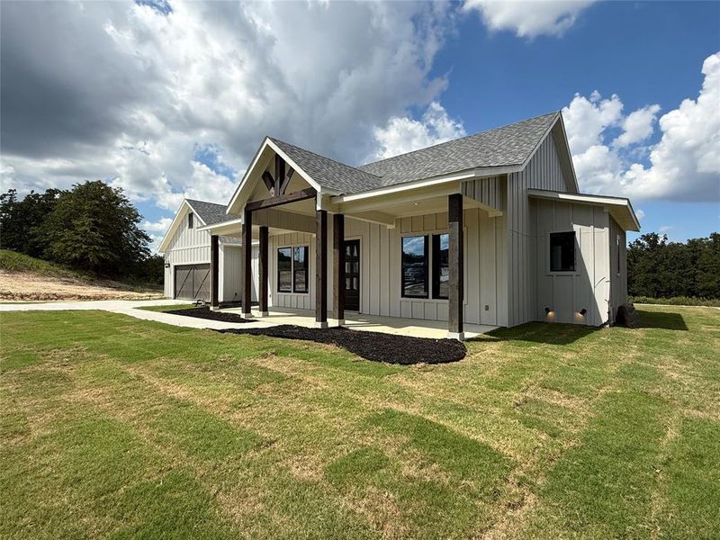Front exterior of a new home in Zion Trails, Poolville, TX, highlighting curb appeal (Image 2). Front exterior of a new home in Zion Trails, Poolville, TX, highlighting curb appeal (Image 2).
