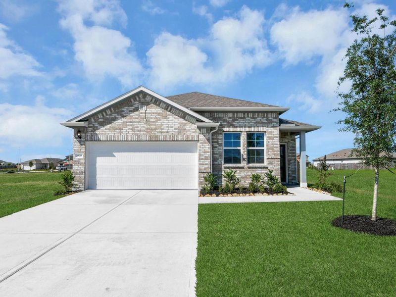 Front exterior of a new home in Emberly, Beasley, TX, highlighting curb appeal (Image 20).