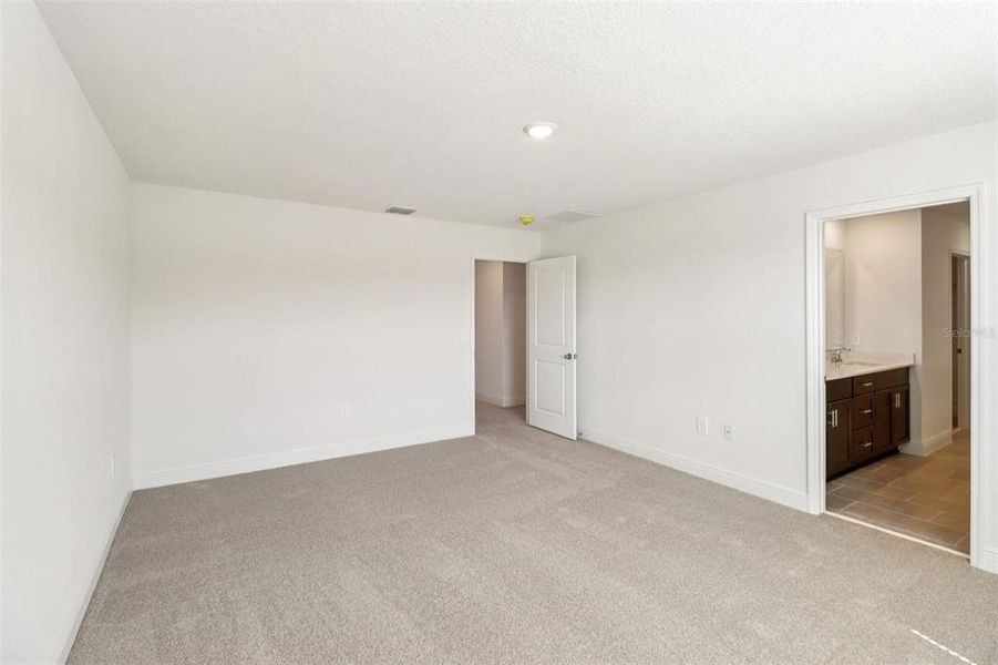 Spacious, unfurnished interior of a new home in The Reserve at Hammock Oaks - Classic Series, Lady Lake (Image 32).