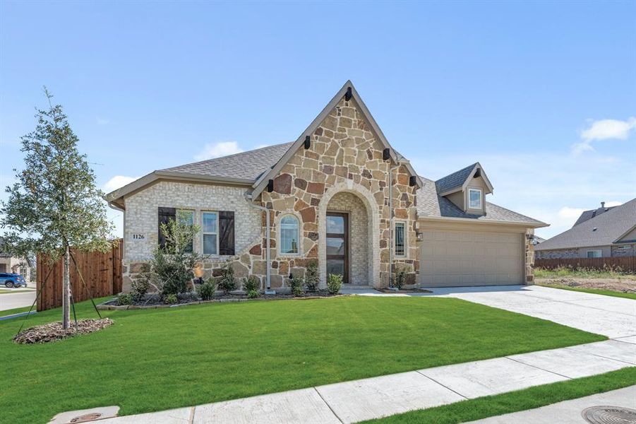 Front exterior of a new home in Timberbrook 3B-4A, Justin, TX, highlighting curb appeal (Image 2).