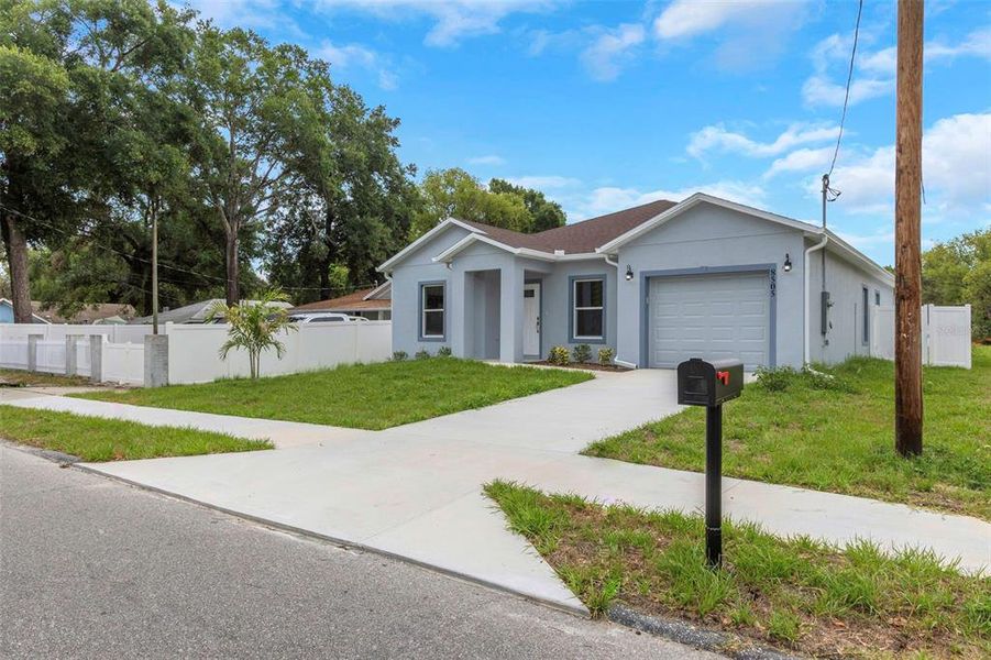 Front exterior of a new home in , Tampa, FL, highlighting curb appeal (Image 27).
