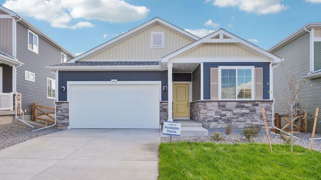 Front exterior of a new home in Banning Lewis Ranch, Colorado Springs, CO, highlighting curb appeal (Image 18). Front exterior of a new home in Banning Lewis Ranch, Colorado Springs, CO, highlighting curb appeal (Image 18).