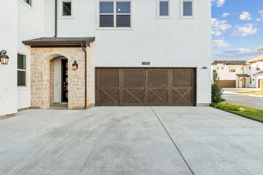 2 car garage with shared driveway.