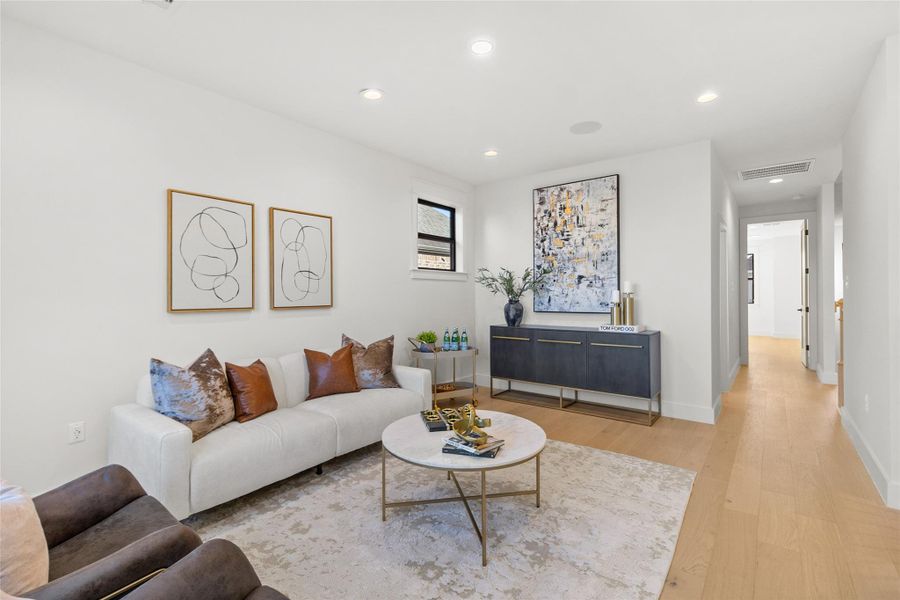 Just beyond the hidden flex space (speakeasy/media/gym), your game room opens up into a polished yet inviting space where everything flows naturally. Styled for comfort and conversation, this area anchors the home and creates the perfect contrast to the tucked-away flex space—open, social, and ready for everyday living.