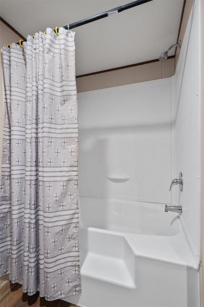 Clean lines and a molded tub surround define this functional bathroom space.