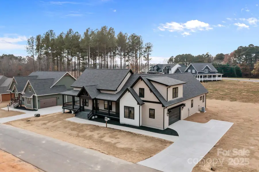 Front exterior of a new home in , Statesville, NC, highlighting curb appeal (Image 1). Front exterior of a new home in , Statesville, NC, highlighting curb appeal (Image 1).