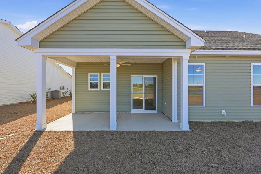 Rear view of house featuring a patio and ceiling fan Rear view of house featuring a patio and ceiling fan
