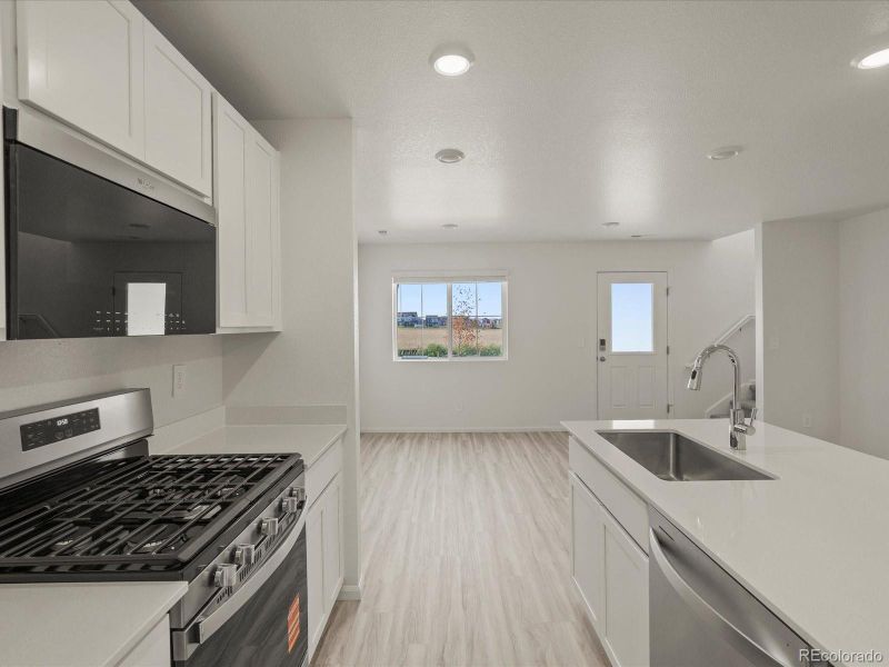 Furnished interior view inside a new home in Skyview at High Point, Aurora (Image 13).