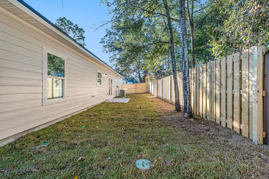 Exterior details and patio area of a home in Live Oak Cottages, Freeport (Image 28). Exterior details and patio area of a home in Live Oak Cottages, Freeport (Image 28).