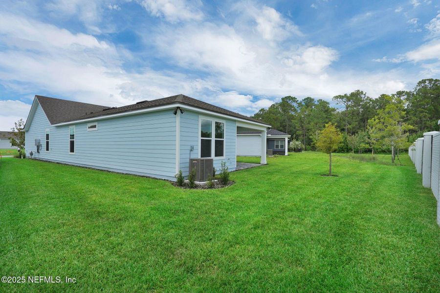 Exterior details and patio area of a home in Summer Bay at Grand Oaks, St. Augustine (Image 22). Exterior details and patio area of a home in Summer Bay at Grand Oaks, St. Augustine (Image 22).