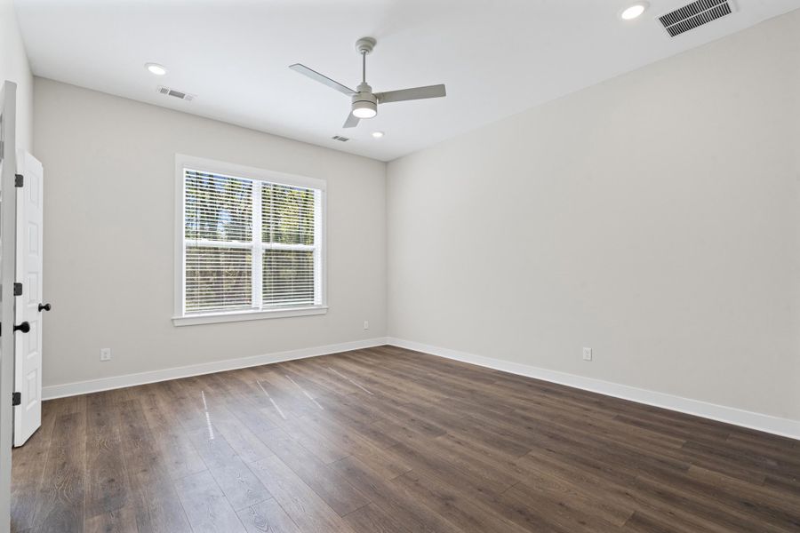 Spare room with a ceiling fan, dark wood finished floors, and recessed lighting Spare room with a ceiling fan, dark wood finished floors, and recessed lighting