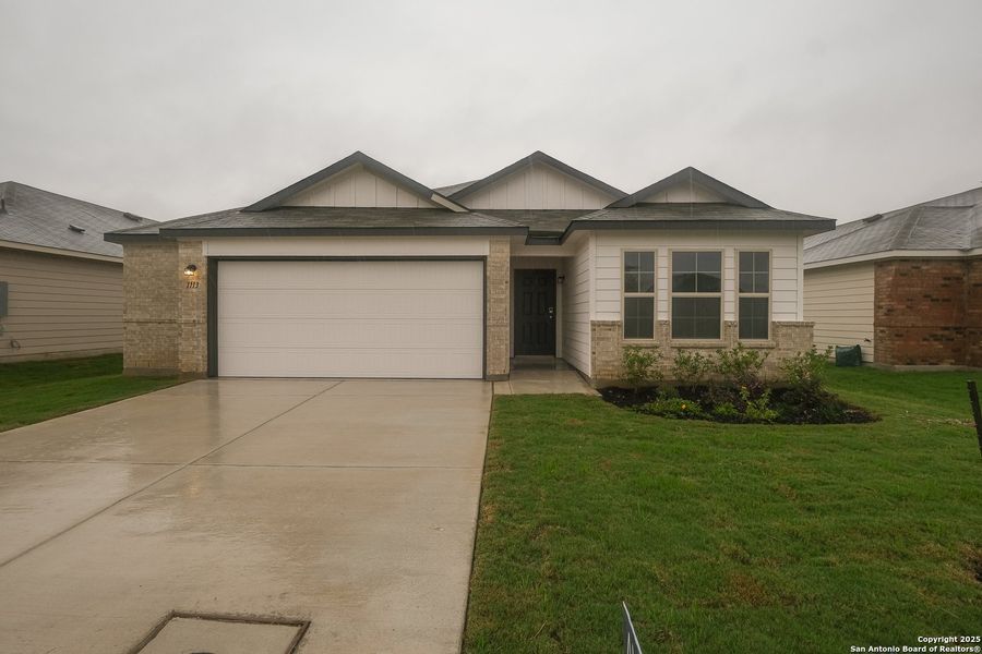 Front exterior of a new home in Greenspoint Heights, Seguin, TX, highlighting curb appeal (Image 18).