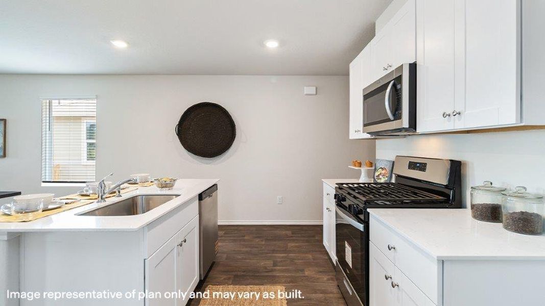 Culinary delights await in this bright kitchen with modern appliances and rich flooring. Culinary delights await in this bright kitchen with modern appliances and rich flooring.