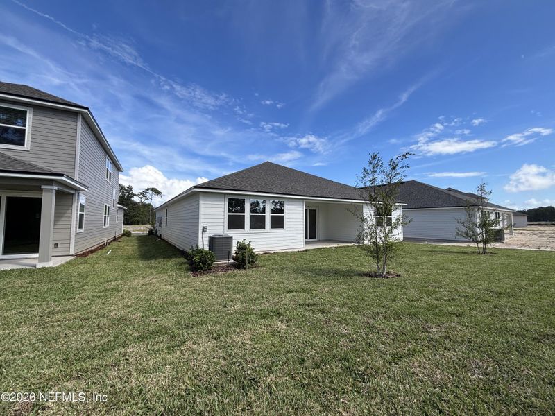 Exterior details and patio area of a home in The Cypress Series at Reserve East, Flagler Beach (Image 4).