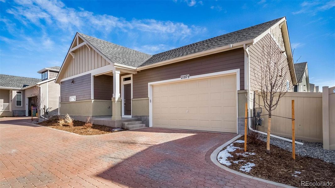 Front exterior of a new home in , Aurora, CO, highlighting curb appeal (Image 22).