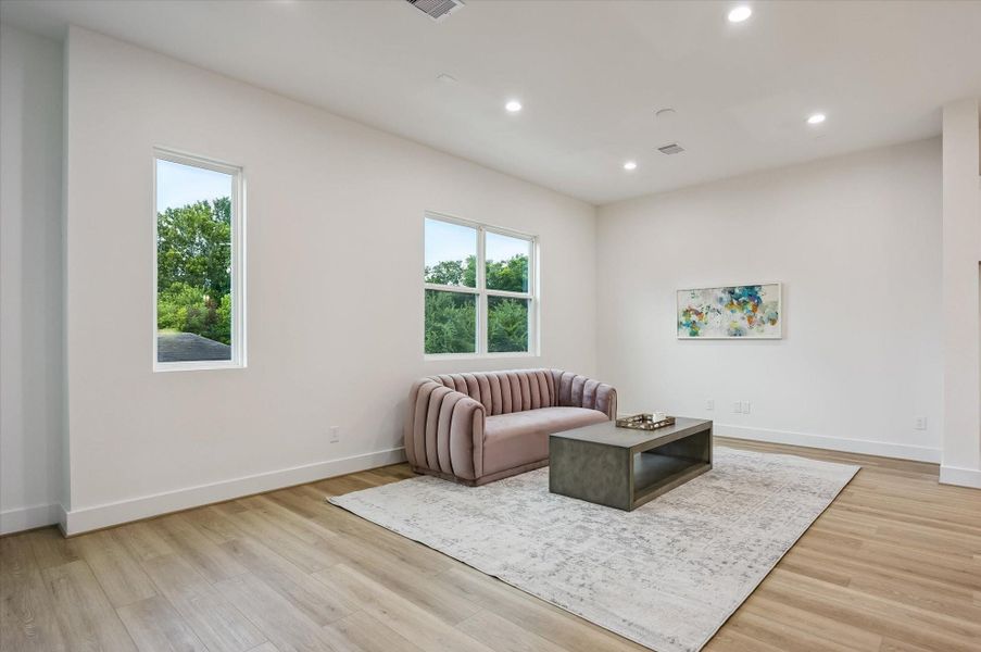 The expansive living room offers an inviting space to gather, entertain, or simply relax in style. The expansive living room offers an inviting space to gather, entertain, or simply relax in style.