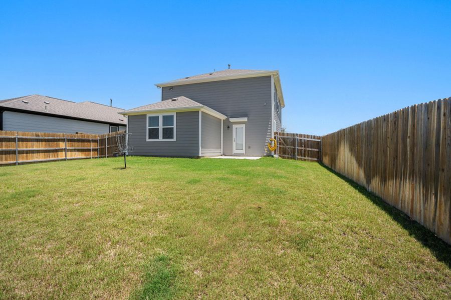 A fenced backyard offers a private retreat for outdoor enjoyment.