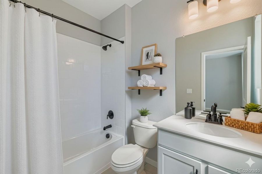 Secondary on-suite bathroom. Photos are not of actual home.